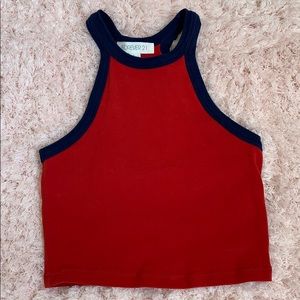 Red crop top with navy trim.